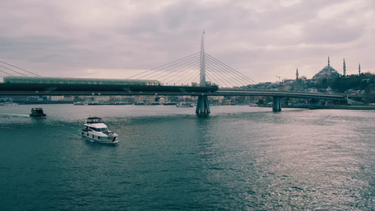 Ferry crossing the Golden Horn under a bridge, Istanbul